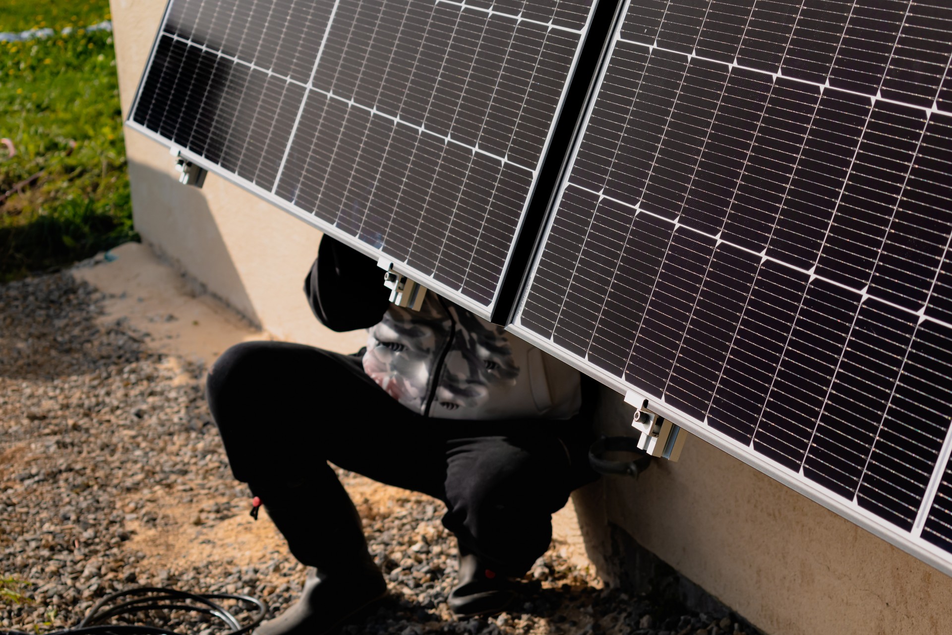 Solar panels on a well-exposed wall of an individual house, making savings following the energy crisis, eco-citizen gesture, green energy